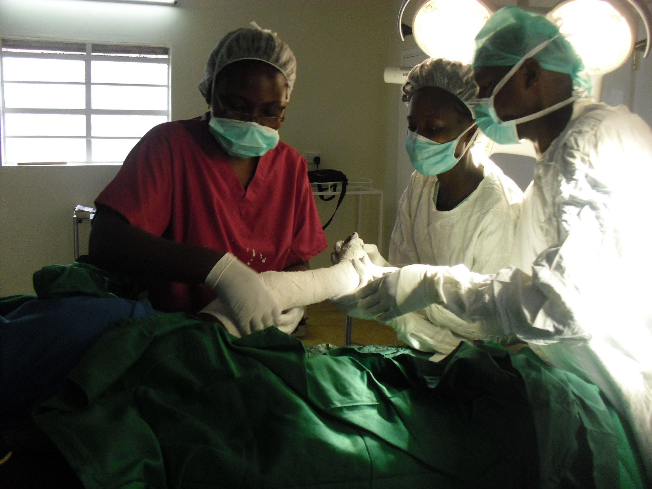 Kenyan staff in theatre club foot